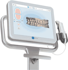 Digital dental scanner displaying 3D teeth and bite analysis on monitor screen.